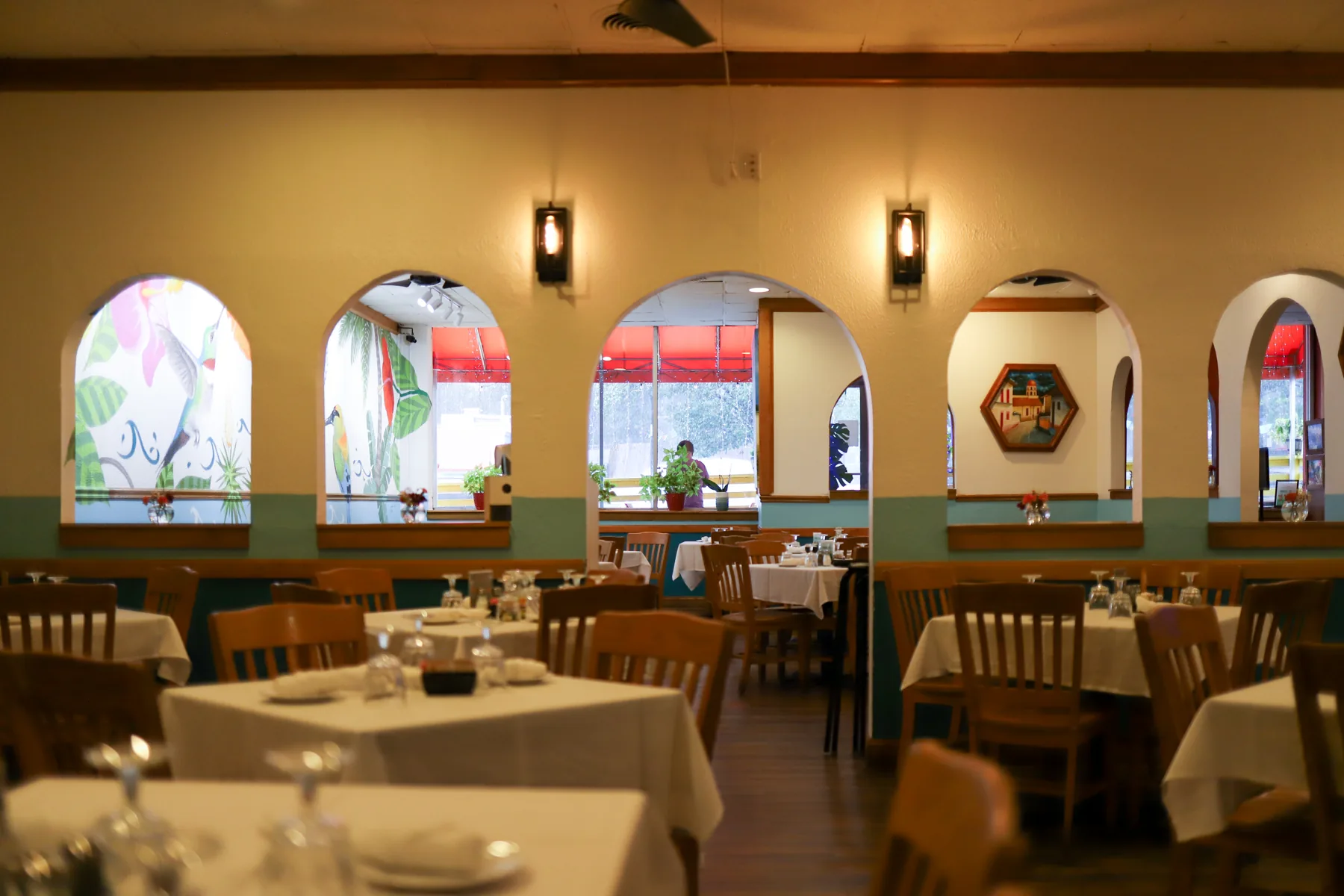 El Golfo dining room with set tables and arched windows
